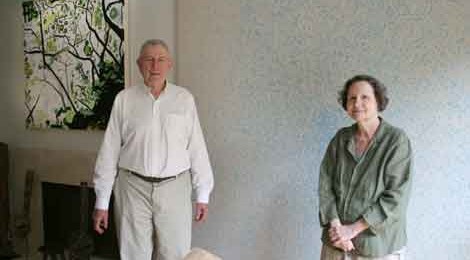 The Schorr’s in their Marina Del Rey house with a Laura Owens painting to the left over the fireplace. Photo by Peter Bartlett