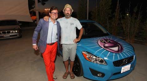 Jamie Brooks and artist Kenny Scharf in front of Brooks’ newly painted car