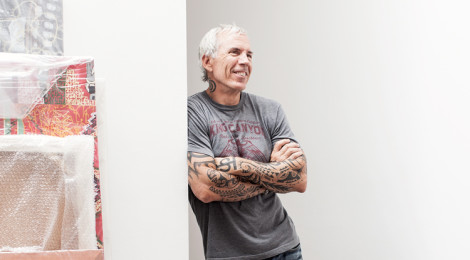 Cliff Benjamin at gallery with artwork, photo by Joe Schmelzer.