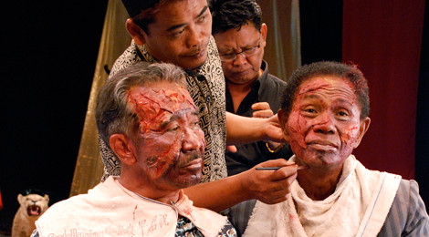 Preparing for a reenactment scene from Drafthouse Film's documentary, The Act Of Killing.