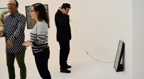The audience is listening...gallerygoer watching London video; Cole Case on left.